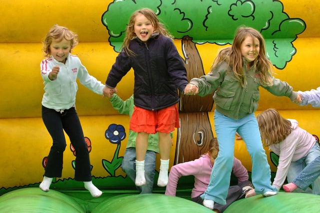 Happy youngsters on a bouncy castle at the National Play Day event at Ashfield Park, Standish.