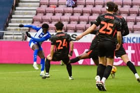 Michael Olakigbe sends Latics' best effort against the Birmingham post