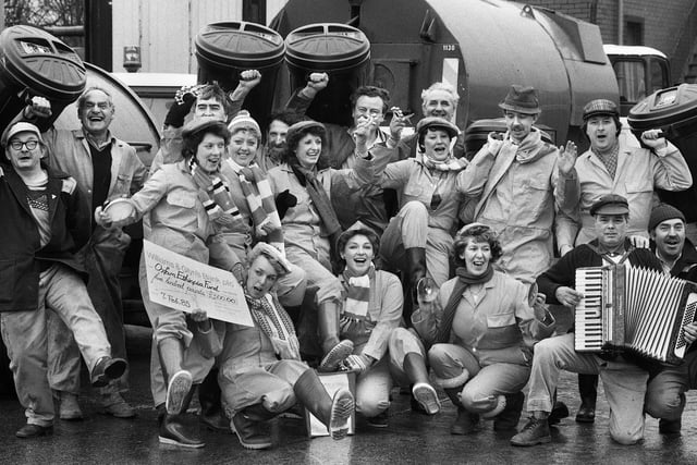 Bin men and office staff at Wigan Cleansing Department in Frog Lane have a rousing sing song raising £500 for the Oxfam Ethiopia Appeal on Thursday 7th of February 1985.