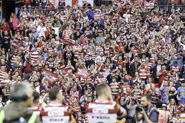 Warriors supporters celebrate the Wembley win with the players