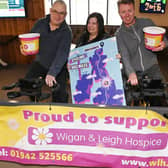 Pub regulars and members of the community have been taking turns to cycle part of the month-long challenge: a 1,206-mile journey which is the distance from Land's End to John O'Groats and bac, on static bikes at The Hawk Pub, Hawkley Hall,  raising funds for Wigan and Leigh Hospice.  Pub manager Claire Bolton, centre, is pictured with Dave Parry, left, and Derek McCabe, right