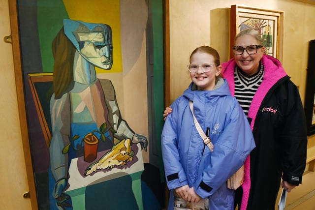 Sam Scales and Molly enjoy the exhibition as they admire Robert Colquhoun's Woman with Still Life (1958)