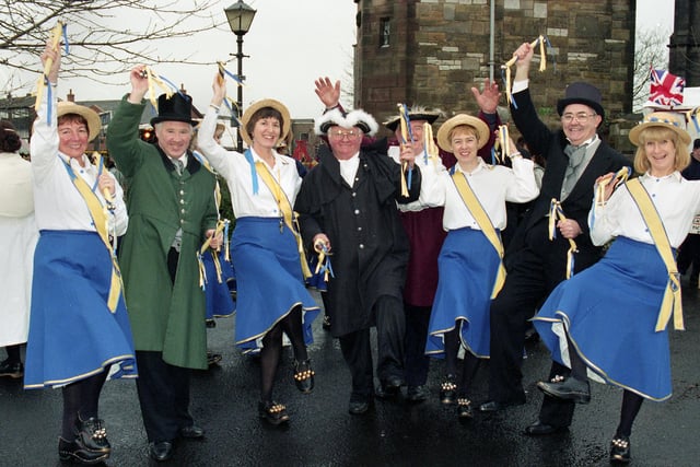 Standish Dickensian Society members David Williams, Bill McCracken, John Eckersley and Norman Lythgoe with members of the Newburgh Morris Group at the Standish Dickensian Day on Saturday 6th of December 1997.