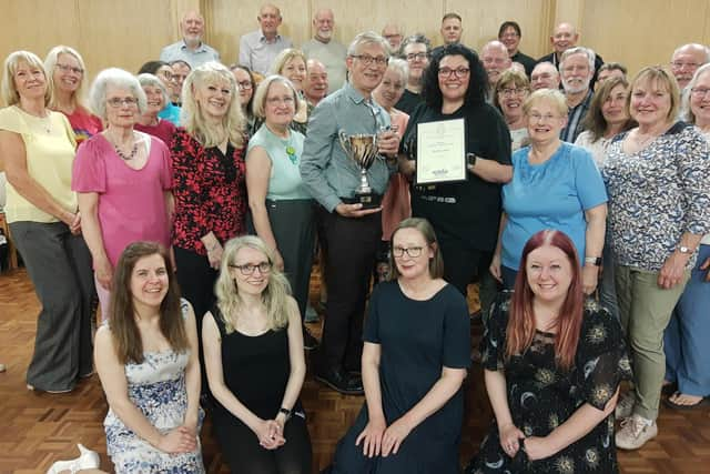 Pictured with the trophy are members of the Gondoliers cast and directors David Kay and Johanna Hassouna-Smith.