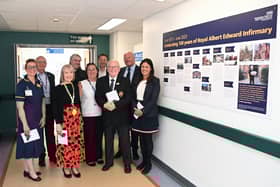 Wigan MP Lisa Nandy is joined by staff and volunteers at the unveiling of the mural