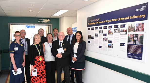 Wigan MP Lisa Nandy is joined by staff and volunteers at the unveiling of the mural