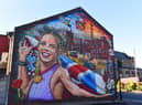 Members of the public joined local councillors and the artists, next to the Atherton mural, depicting Olympic, World and European medal-winning Athlete Keely Hodgkinson, on Church Street, Atherton.