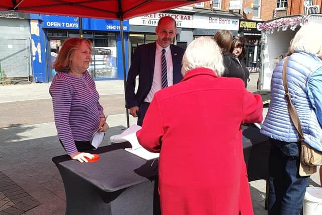 Leigh MP James Grundy speaking to residents at the Friends of Tyldesley Library stall