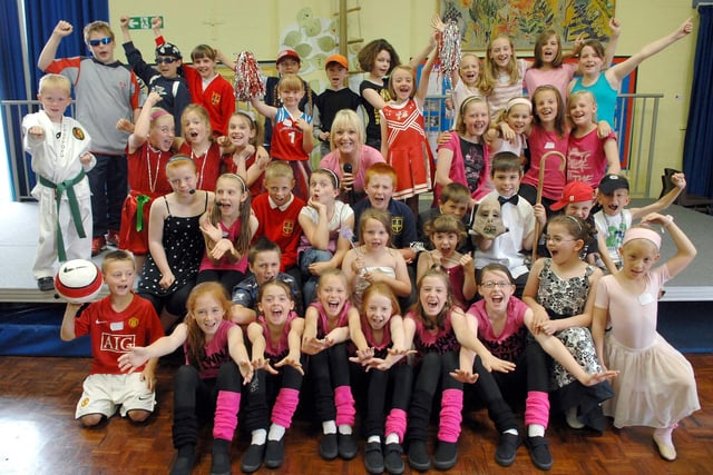 2008  -= Singer Lauren Waterworth with pupils from St Peter's CE  Primary School, Hindley, at the 'St Peter's Got Talent' contest final during music week.