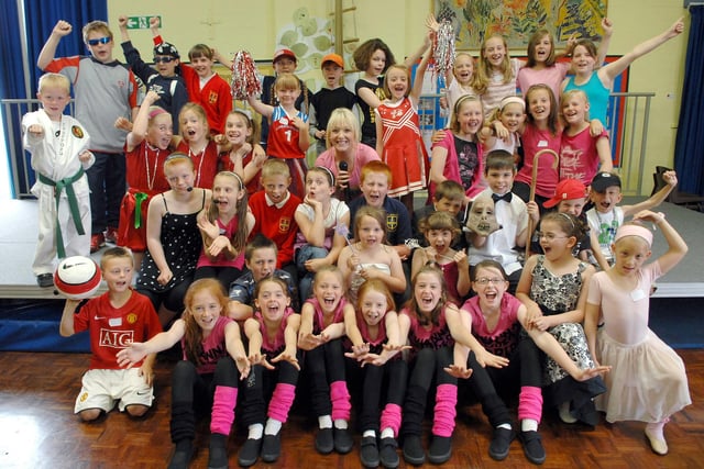 2008 -= Singer Lauren Waterworth with pupils from St Peter's CE Primary School, Hindley, at the 'St Peter's Got Talent' contest final during music week.