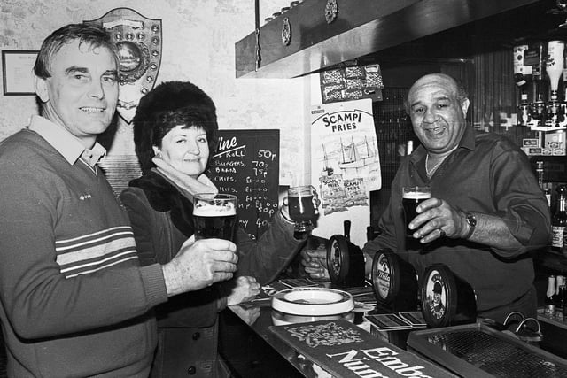 Wigan rugby legend Billy Boston behind the bar in his pub The Griffin on Standishgate Wigan in 1985