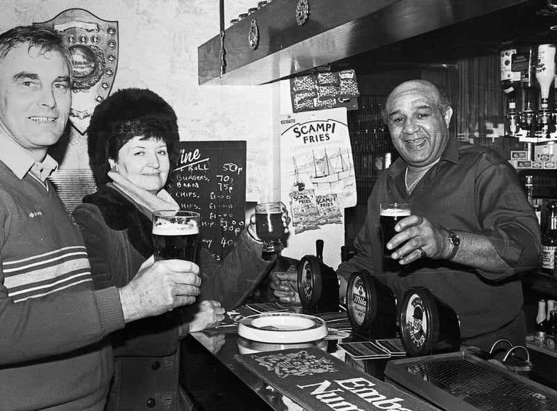 Wigan rugby legend Billy Boston behind the bar in his pub The Griffin on Standishgate Wigan in 1985