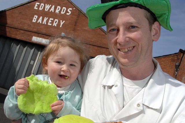 2009 - Duncan Edwards, of Edwards Bakery, Platt Bridge, and daughter Takira, two, with the Irish stew pies and green barm cakes to celebrate St Patrick's Day.