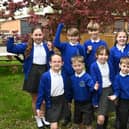 Headteacher Cathy Whalley and pupils at Winstanley Community Primary School celebrate their "outstanding" Ofsted report