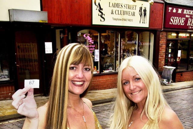 Margaret Blakemore, left, who played June Meadows in Coronation Street, makes a charity draw for Vicky Cass-Buckley, owner of Cass Ladies Street and Clubwear in Hallgate on Monday 30th of October 2000. 