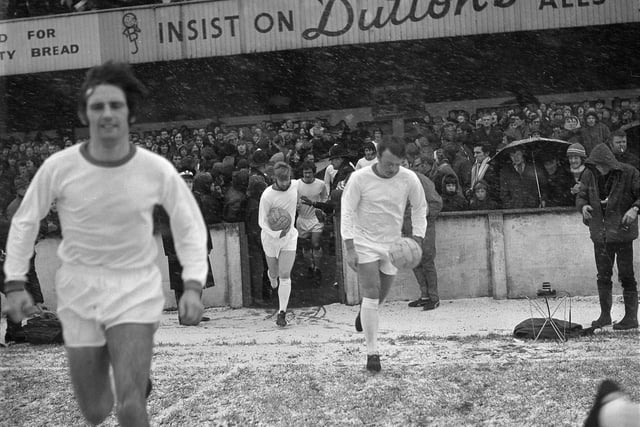 Players brave the snow and freezing temperatures  for the FA Cup Round One match against Halifax