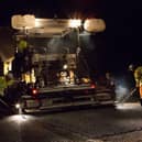 National Highways workers performing overnight resurfacing work