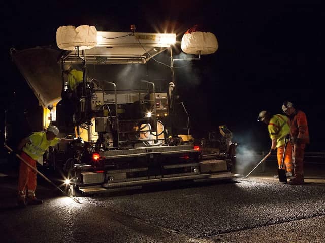 National Highways workers performing overnight resurfacing work