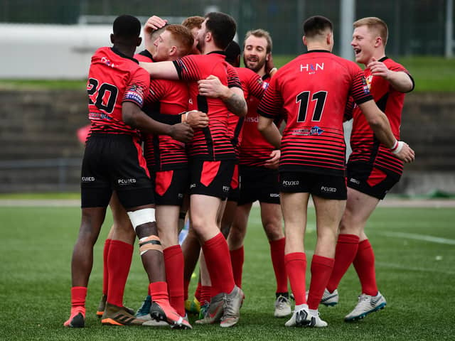 London Skolars celebrate after Omani Caro scores a try against Workington Town in 2019
