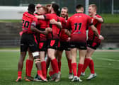 London Skolars celebrate after Omani Caro scores a try against Workington Town in 2019