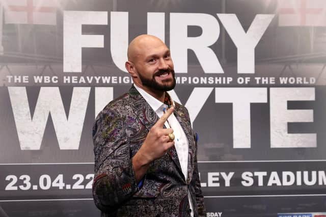 Tyson Fury gestures during the Tyson Fury v Dillian Whyte press conference at Wembley Stadium on March 01, 2022 in Londo