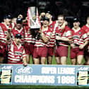 The Wigan team wins the Inaugural Grand Final of the JJB Super League against Leeds at Old Trafford in Manchester
