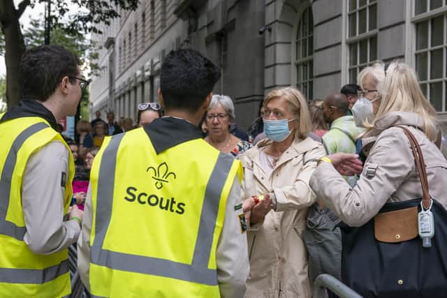 Scouts talking to people in the queue