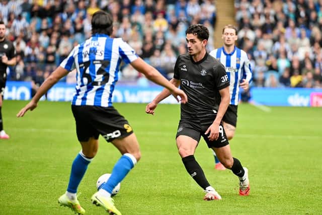 Sonny Perkins competes for the ball at Hillsborough