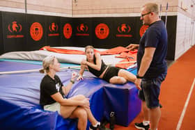 Keely Hodgkinson with her coaches Trevor Painter and Jenny Meadows, during a break in training at Wigan