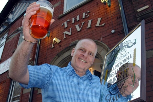 The Anvil on Dorning Street in Wigan is The Pub of the Year 2002, awarded by CAMRA - The Campaign for Real Ale. Pictured with the Alan Ball Award is landlord Ian Thorpe. 

