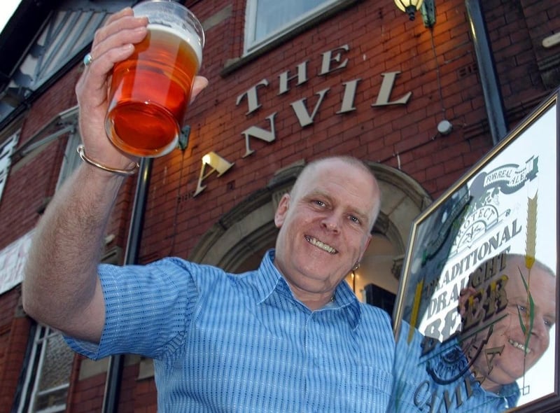 The Anvil on Dorning Street in Wigan is The Pub of the Year 2002, awarded by CAMRA - The Campaign for Real Ale. Pictured with the Alan Ball Award is landlord Ian Thorpe.