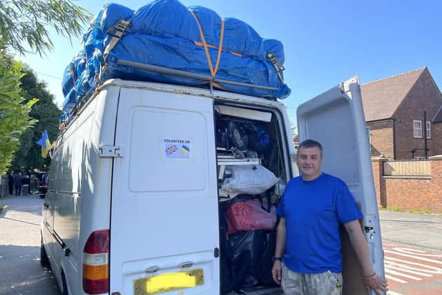 Ruslan with a van loaded with humanitarian aid items which he is driving all the way from the UK to the border of Ukraine.