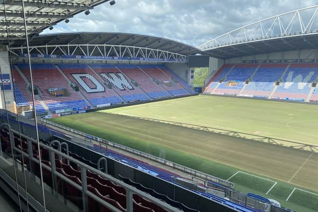 The pitch maintenance is already under way at Wigan Athletic