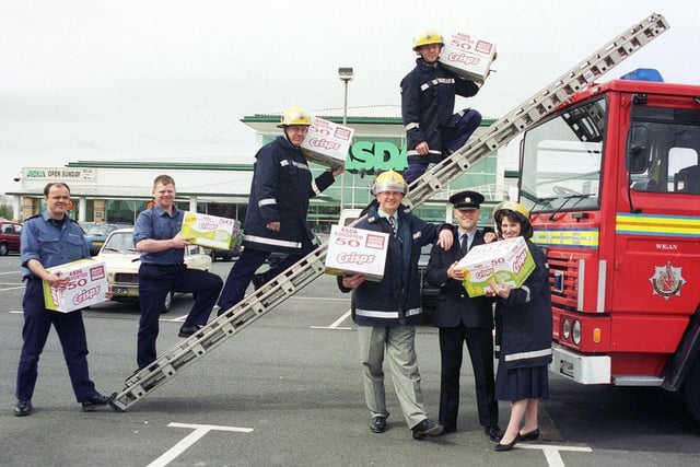 RETRO 1996
Wigan's firefighters prepare for a charity sponsored event with supplies donated by Asda supermarket

