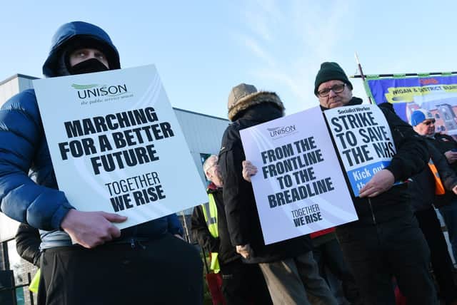 Strikers on the picket line outside Wigan Community Fire and Ambulance Station