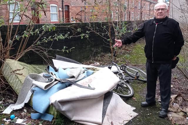 Coun George Davies highlighted fly-tipping in Spring Gardens, Wigan, earlier this year