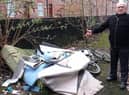 Coun George Davies highlighted fly-tipping in Spring Gardens, Wigan, earlier this year
