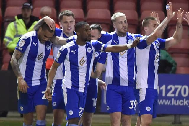 The Latics players enjoy the win at Crewe