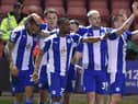 The Latics players enjoy the win at Crewe
