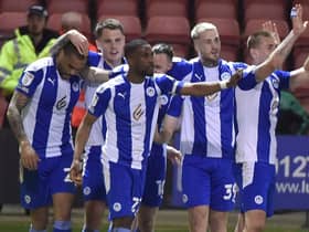 The Latics players enjoy the win at Crewe