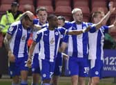The Latics players enjoy the win at Crewe