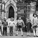 Local children outside Holy Trinity Church, Downall Green, in July 1972.