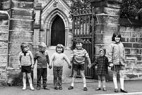 Local children outside Holy Trinity Church, Downall Green, in July 1972.