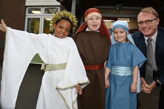 Head of school Adam Rigby with reception children, as they get ready to perform in their nativity at St Paul's CE Primary School, Goose Green, Wigan.