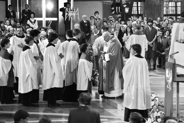 Pope John Paul 11 hands out Communion during Mass at the Metropolitan Cathedral of Christ the King during his visit to Liverpool on Sunday 30th of May 1982.