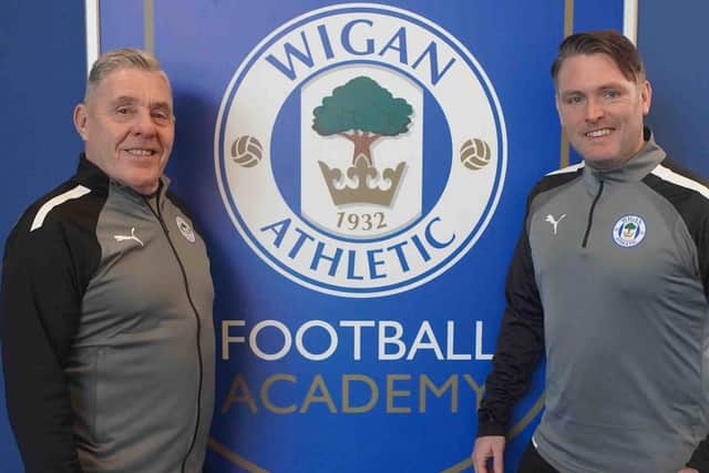 Club legend Barry Knowles, pictured with Dean Sibson, is back at Wigan Athletic