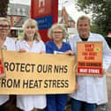 Doctors, scientists and members of the public outside Wigan Infirmary raising issues about overheated hospitals