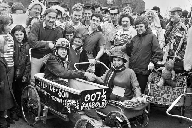 Competitors gather for the start of a pram race near St. Teresa's RC Church, College Road, Up Holland, in April 1966.