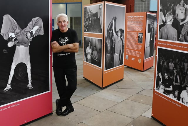 Photographer Francesco Mellina at his exhibition on Standishgate, Wigan.