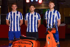 Charlie Hughes, Callum Lang and Liam Morrison model the new Latics kit